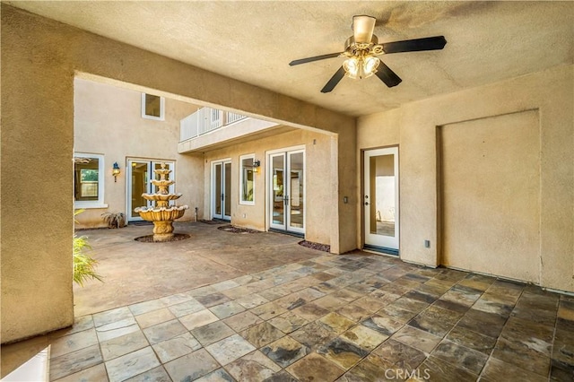 view of patio featuring ceiling fan