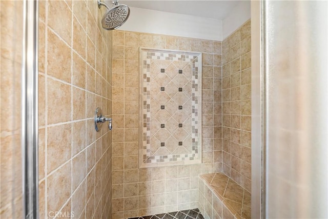 full bathroom with tiled shower