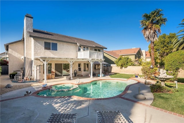 view of swimming pool with an in ground hot tub and a patio area