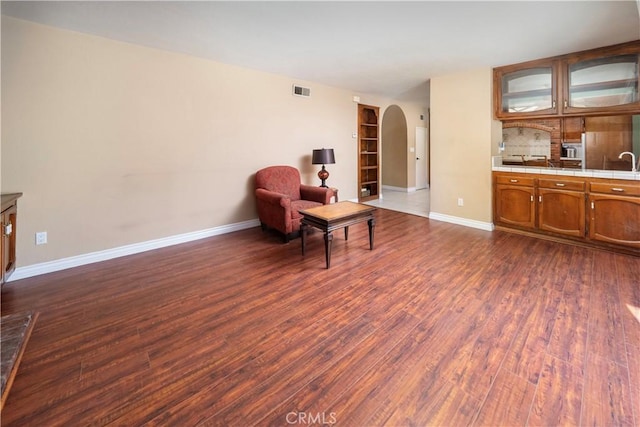 living area featuring dark wood-type flooring