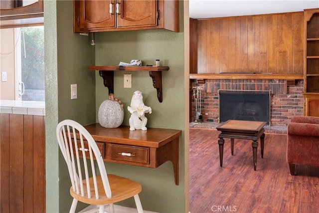 office with a fireplace and hardwood / wood-style flooring