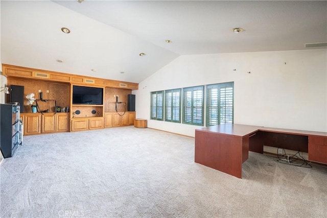 living room with light carpet, built in shelves, and lofted ceiling