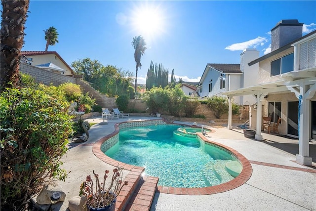 view of pool featuring an in ground hot tub and a patio