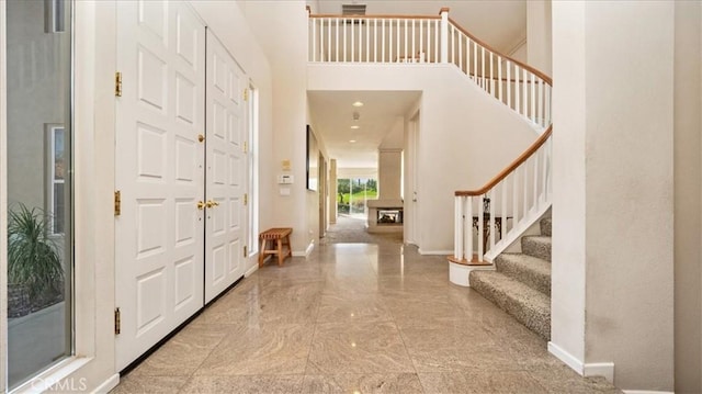 foyer featuring a high ceiling