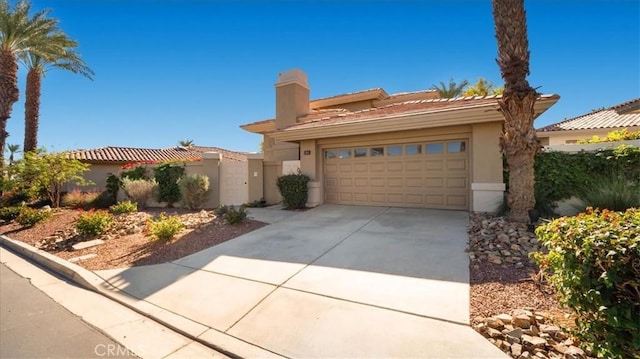 mediterranean / spanish-style house featuring a garage