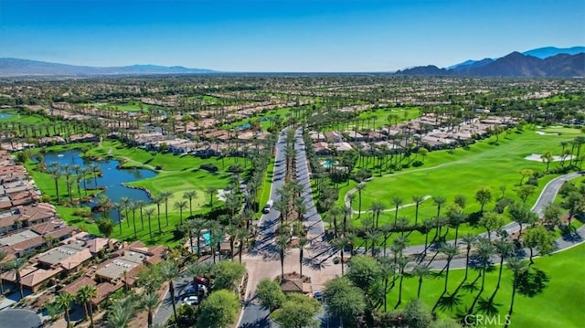 birds eye view of property with a water and mountain view