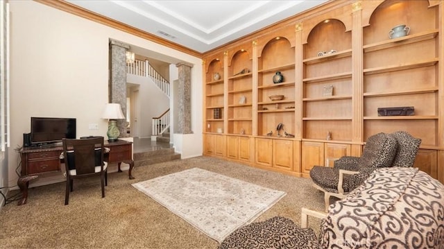 living area featuring built in shelves and carpet