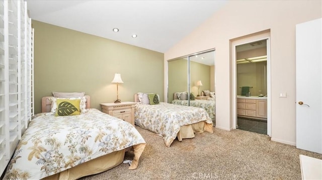 bedroom featuring carpet and lofted ceiling