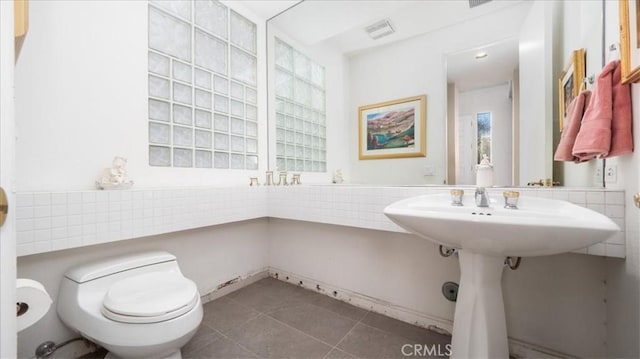 bathroom with tile patterned flooring and toilet