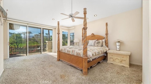 carpeted bedroom featuring access to outside, multiple windows, and ceiling fan