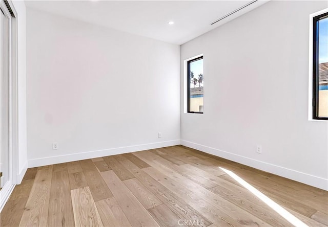 spare room featuring light wood-type flooring