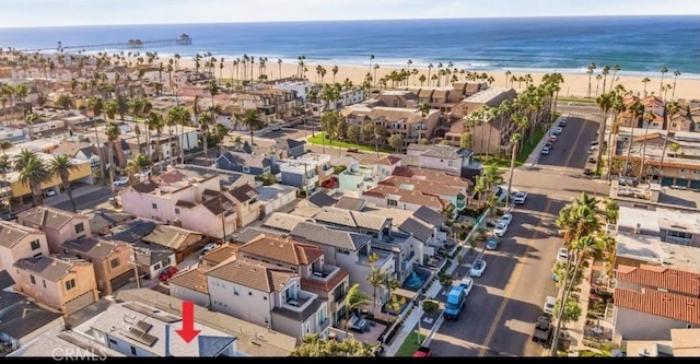 bird's eye view with a water view and a view of the beach