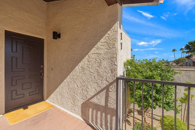 entrance to property with a balcony