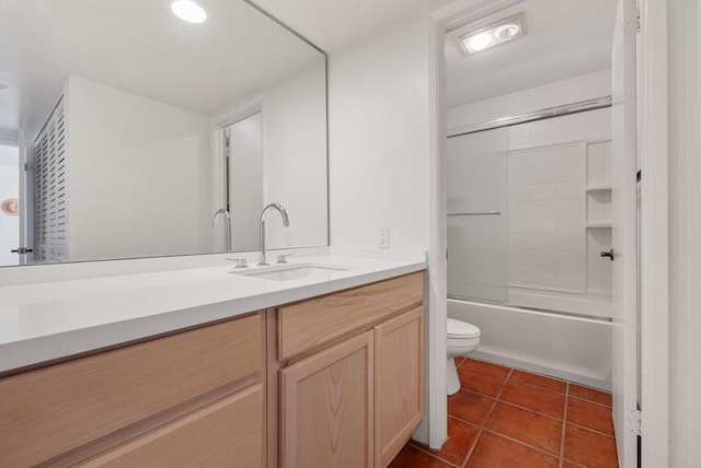 full bathroom with tile patterned floors, vanity, toilet, and bath / shower combo with glass door