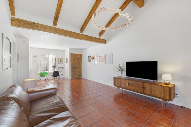 living room with tile patterned floors and beamed ceiling