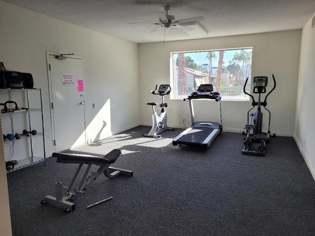 exercise room featuring a textured ceiling and ceiling fan