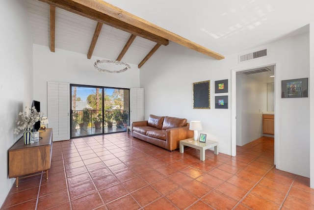 living room with beamed ceiling, tile patterned floors, and high vaulted ceiling