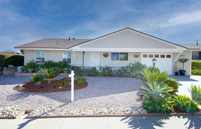 single story home with a garage