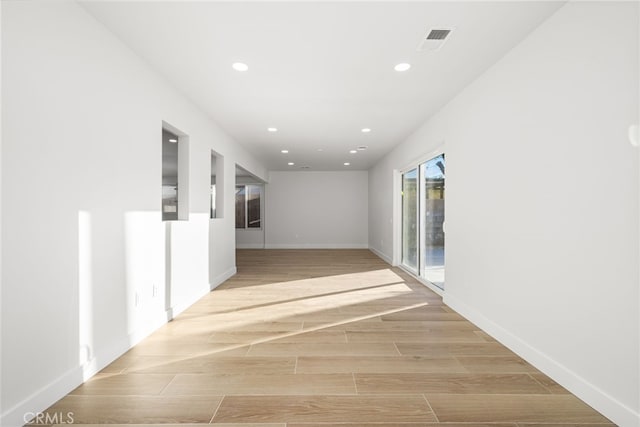 hallway featuring light wood-type flooring