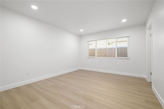 empty room with light wood-type flooring