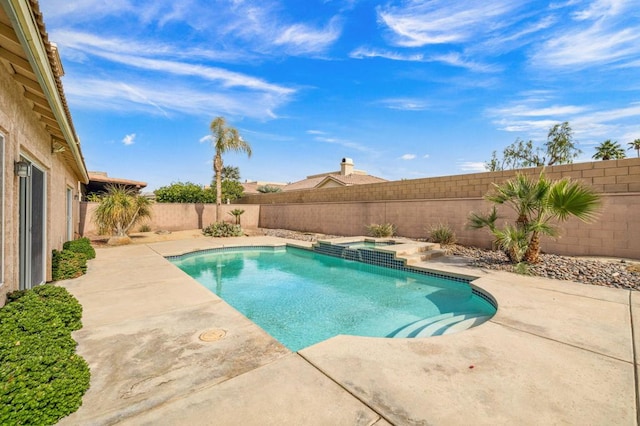 view of pool with an in ground hot tub