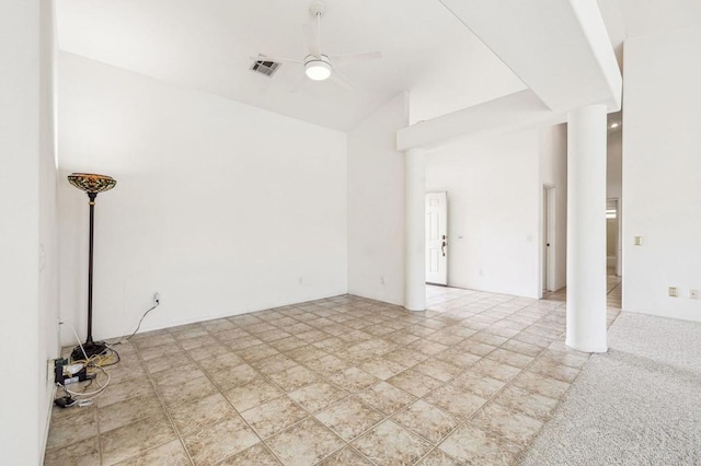 carpeted spare room featuring ceiling fan and high vaulted ceiling