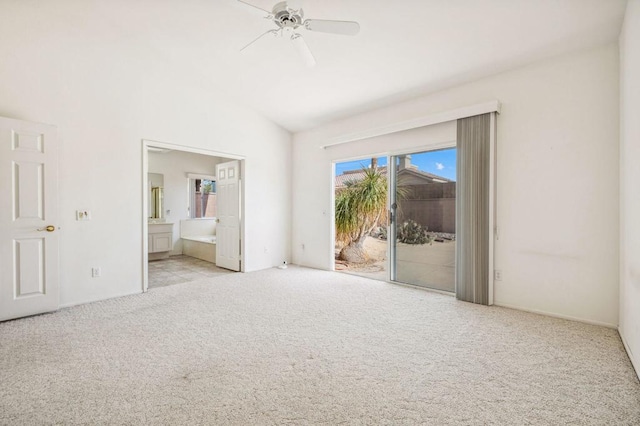 unfurnished bedroom featuring ensuite bath, access to outside, vaulted ceiling, ceiling fan, and light colored carpet