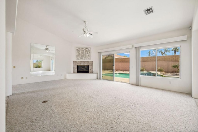 unfurnished living room with carpet flooring, ceiling fan, and lofted ceiling