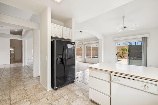 kitchen featuring white cabinetry, dishwasher, ceiling fan, black refrigerator with ice dispenser, and light tile patterned floors