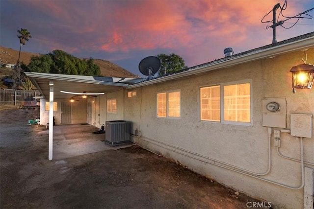 exterior space featuring central AC, a patio, and fence