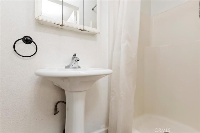 bathroom with a shower stall