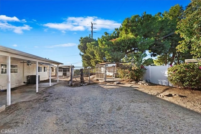 view of yard with cooling unit and a fenced backyard