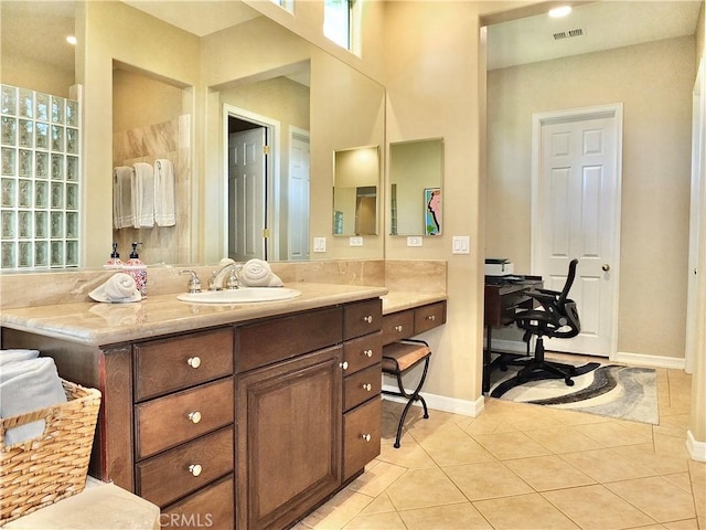 bathroom featuring vanity and tile patterned flooring