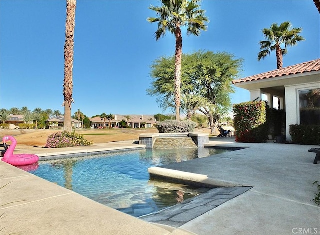 view of swimming pool featuring a patio area