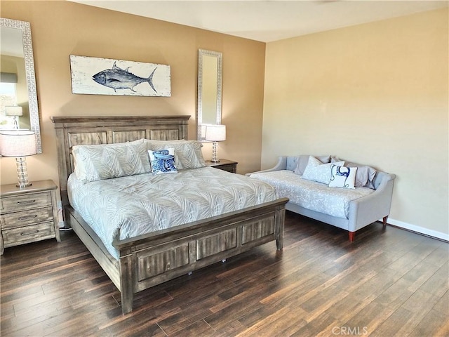 bedroom with dark wood-type flooring