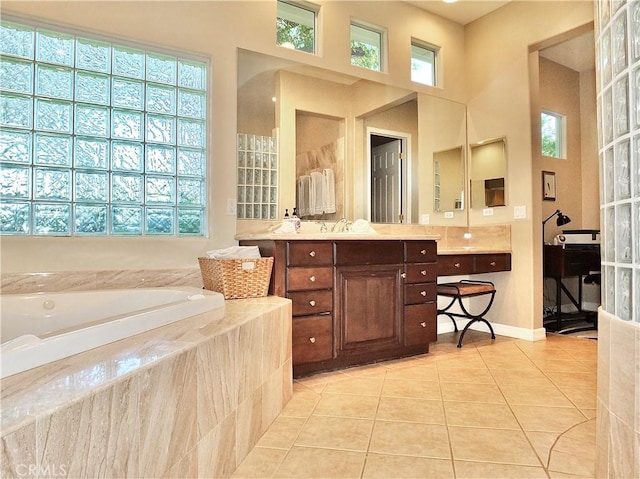 bathroom with plenty of natural light, tile patterned floors, and vanity