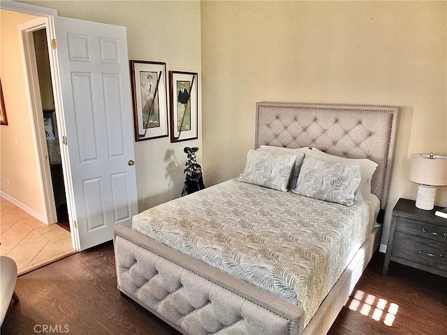 bedroom featuring dark wood-type flooring