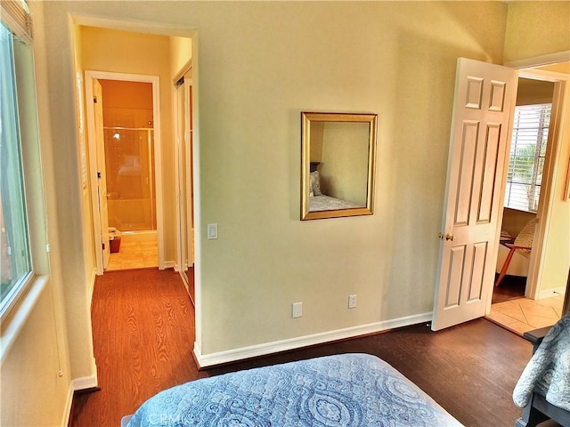 bedroom featuring dark wood-type flooring