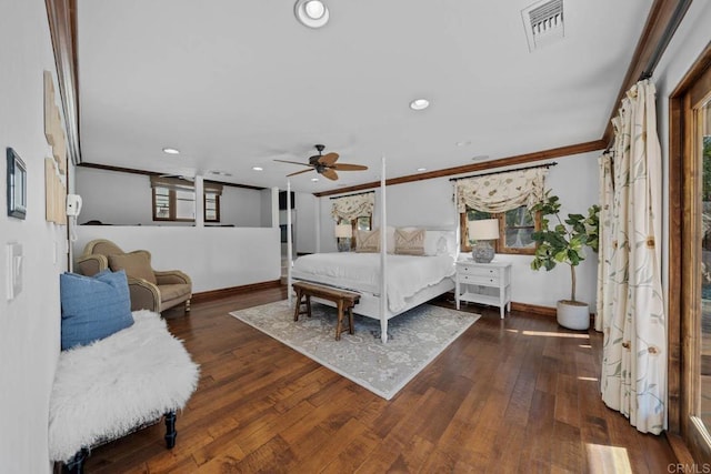 bedroom with ceiling fan, dark hardwood / wood-style floors, and crown molding