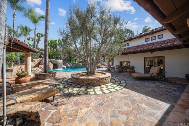 view of patio / terrace with pool water feature