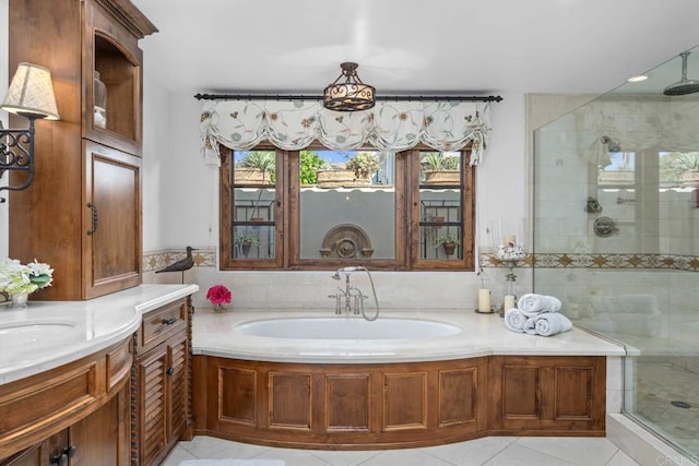 bathroom featuring a wealth of natural light, tile patterned flooring, and shower with separate bathtub