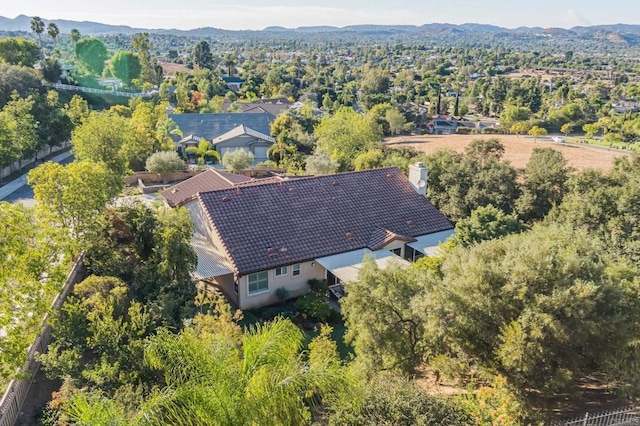 birds eye view of property featuring a mountain view