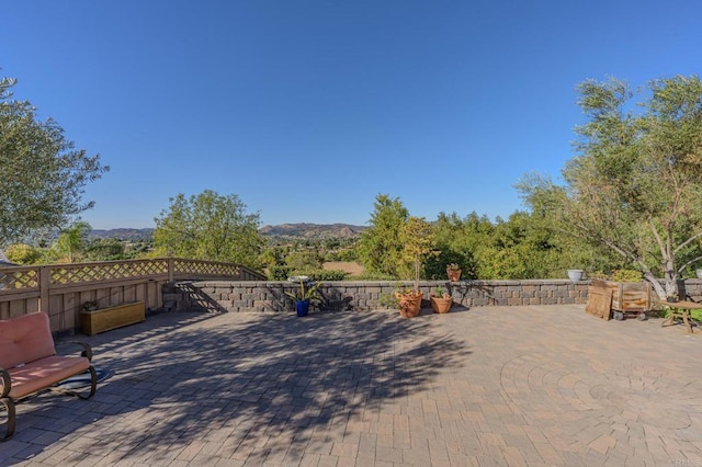 view of patio / terrace with a mountain view