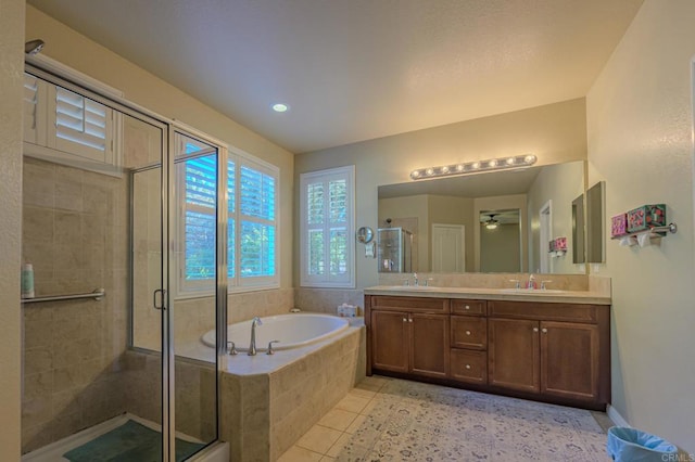 bathroom featuring plus walk in shower, vanity, tile patterned floors, and ceiling fan