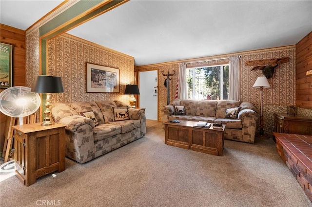 living room featuring carpet flooring, wood walls, and crown molding