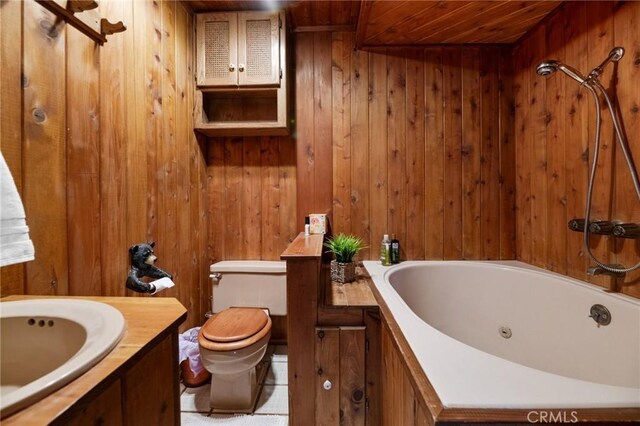 bathroom featuring wood walls, tile patterned floors, sink, toilet, and wood ceiling