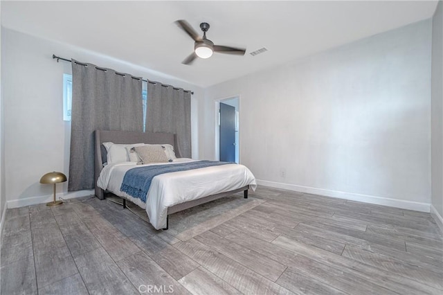 bedroom featuring ceiling fan and wood-type flooring