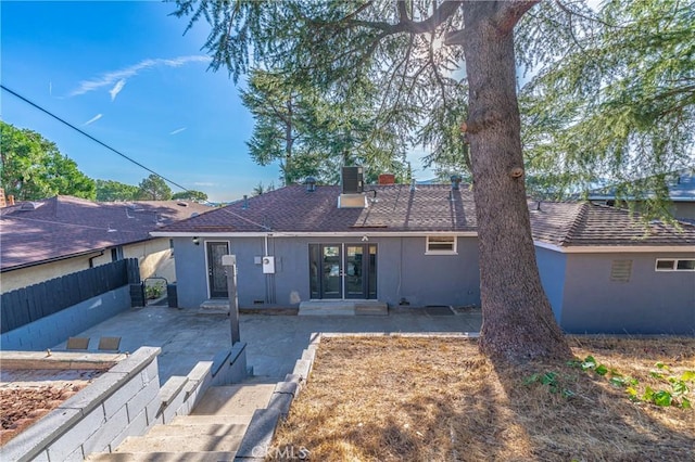 rear view of house featuring central AC and a patio