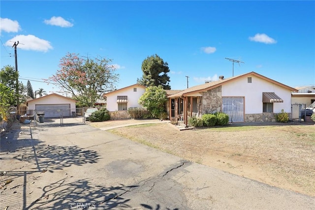 ranch-style home featuring an outbuilding and a garage