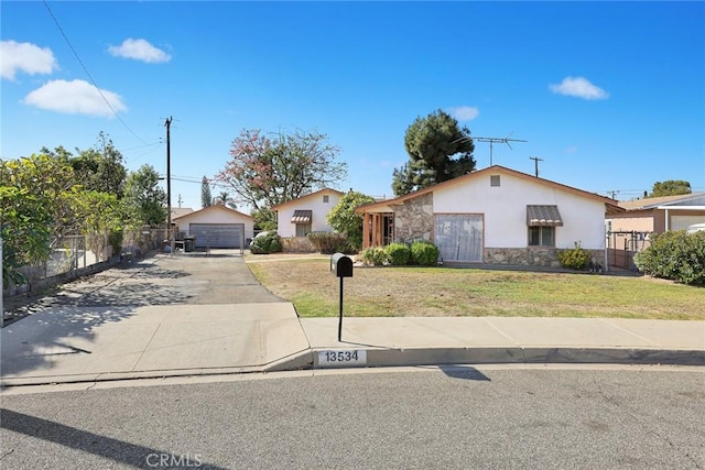 view of front of property with an outbuilding and a garage